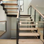 Stair rail system made from steel, wood, & glass